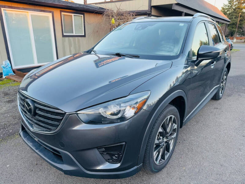 Used 2016 Mazda CX-5 Grand Touring with VIN JM3KE4DY8G0673377 for sale in Tacoma, WA