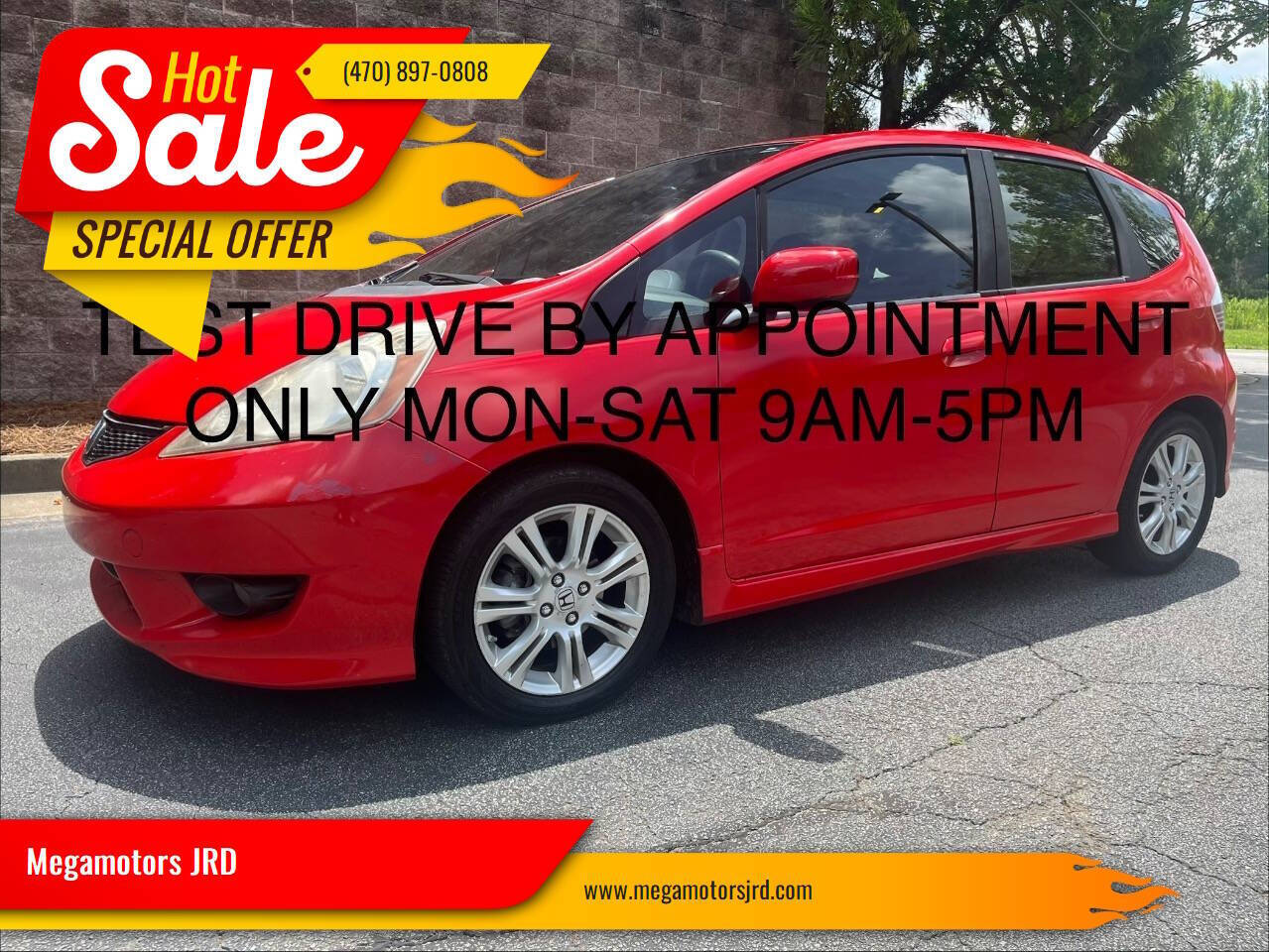 Red 2009 Honda Fit Hatchback Front-Wheel Drive 5-Speed Automatic