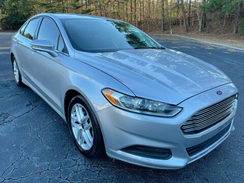 2014 Ford Fusion for sale at Legacy Motor Sales in Norcross GA