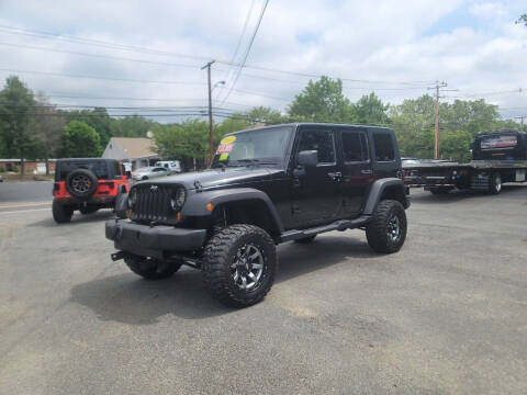 2010 Jeep Wrangler Unlimited for sale at Hometown Automotive Service & Sales in Holliston MA