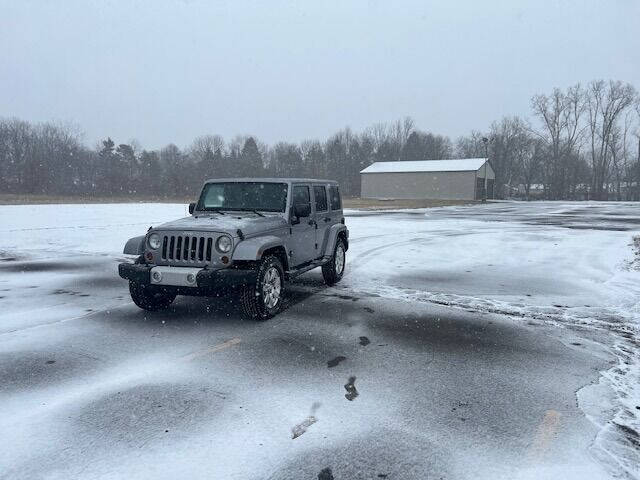 2013 Jeep Wrangler Unlimited for sale at Caruzin Motors in Flint MI