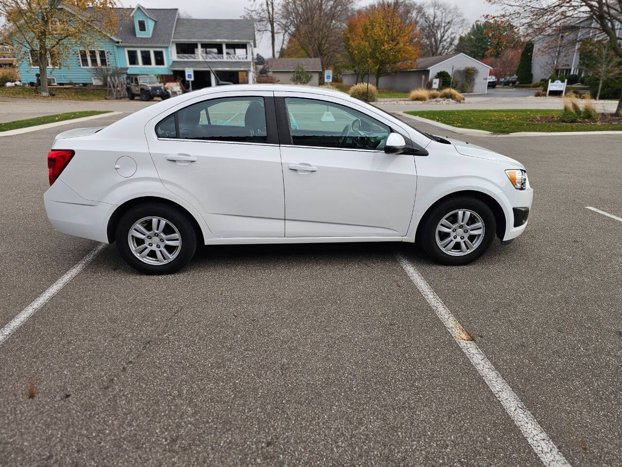 2014 Chevrolet Sonic for sale at WAGNER AUTO MART LLC in Ann Arbor, MI