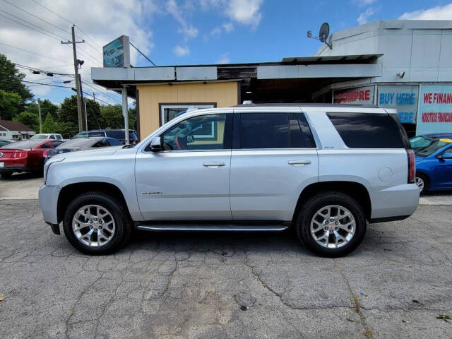 2016 GMC Yukon for sale at DAGO'S AUTO SALES LLC in Dalton, GA