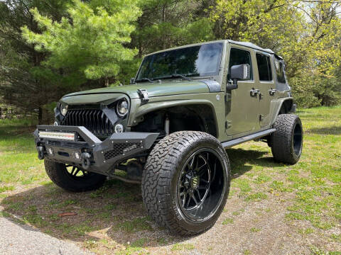 2015 Jeep Wrangler Unlimited for sale at Rombaugh's Auto Sales in Battle Creek MI