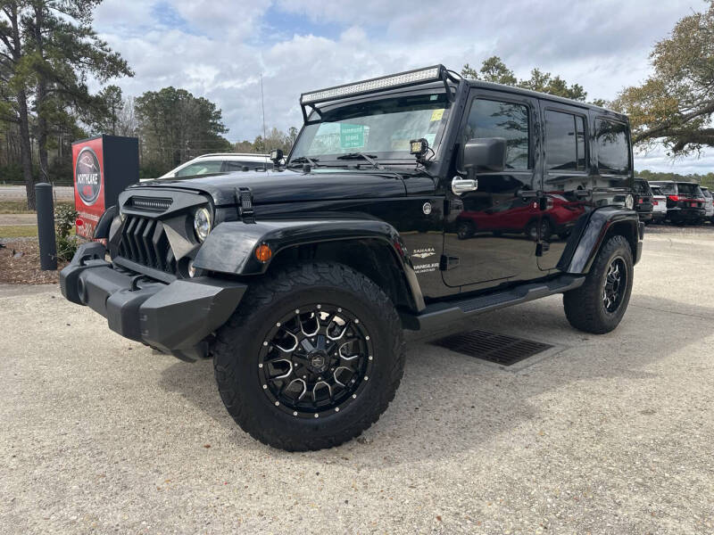 Used 2015 Jeep Wrangler Unlimited Sahara with VIN 1C4HJWEG6FL592696 for sale in Natchez, MS