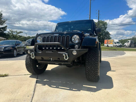 2014 Jeep Wrangler Unlimited for sale at A&C Auto Sales in Moody AL