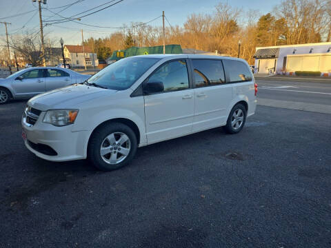 2013 Dodge Grand Caravan for sale at Maximum Auto Group II INC in Cortland OH