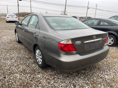 2005 Toyota Camry for sale at HEDGES USED CARS in Carleton MI