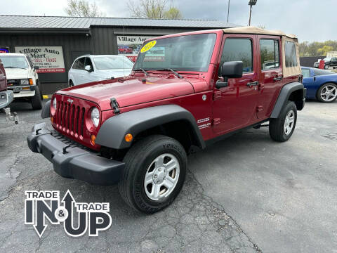 2012 Jeep Wrangler Unlimited for sale at VILLAGE AUTO MART LLC in Portage IN