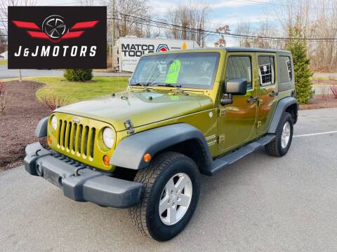 2010 Jeep Wrangler Unlimited for sale at J & J MOTORS in New Milford CT