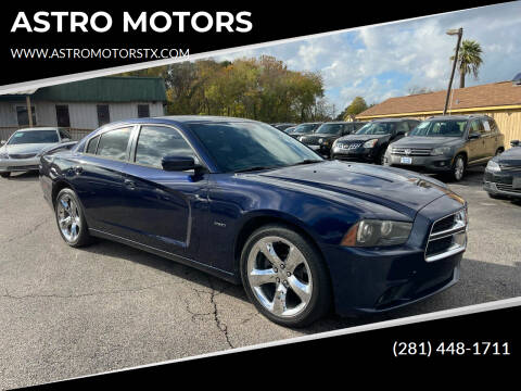 2013 Dodge Charger for sale at ASTRO MOTORS in Houston TX