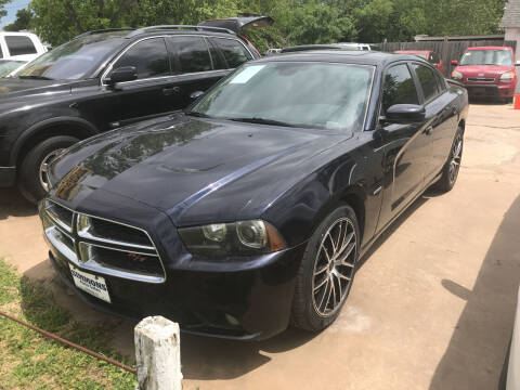 2012 Dodge Charger for sale at Simmons Auto Sales in Denison TX