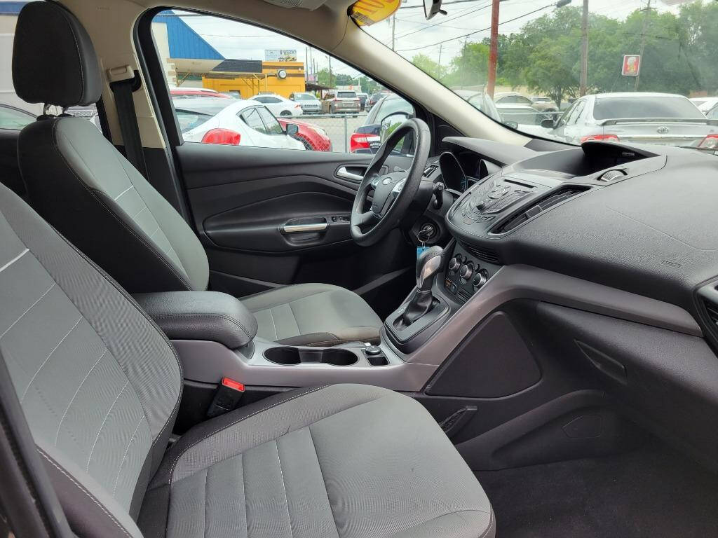 2015 Ford Escape for sale at DAGO'S AUTO SALES LLC in Dalton, GA