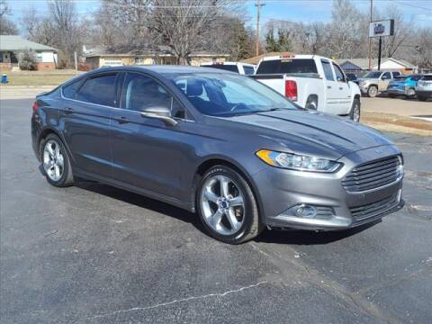 2014 Ford Fusion for sale at HOWERTON'S AUTO SALES in Stillwater OK