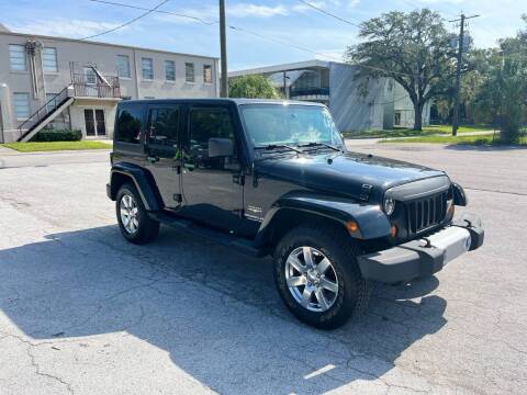 2013 Jeep Wrangler Unlimited for sale at Tampa Trucks in Tampa FL
