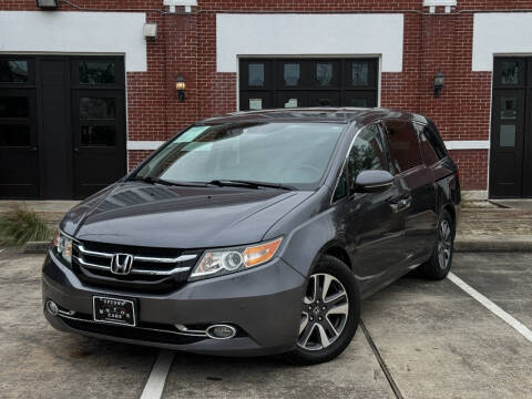 2016 Honda Odyssey for sale at UPTOWN MOTOR CARS in Houston TX