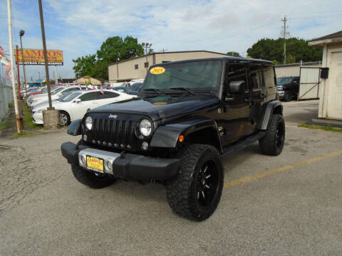 2015 Jeep Wrangler Unlimited for sale at Campos Trucks & SUVs, Inc. in Houston TX