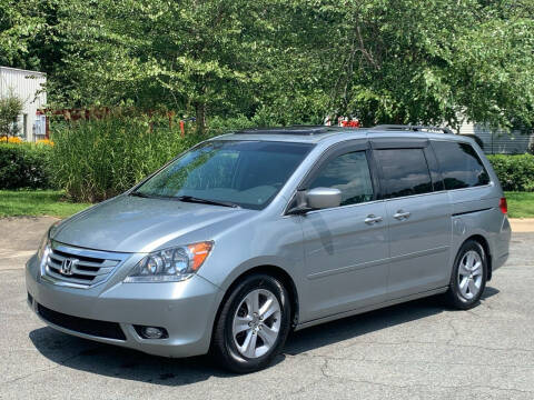 2010 Honda Odyssey for sale at Triangle Motors Inc in Raleigh NC