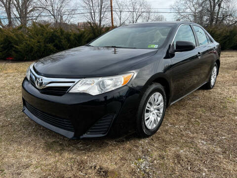 2012 Toyota Camry for sale at PUTNAM AUTO SALES INC in Marietta OH