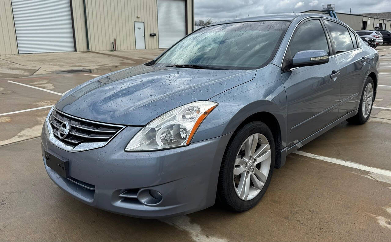 2012 Nissan Altima for sale at CAR MARKET AUTO GROUP in Sugar Land, TX