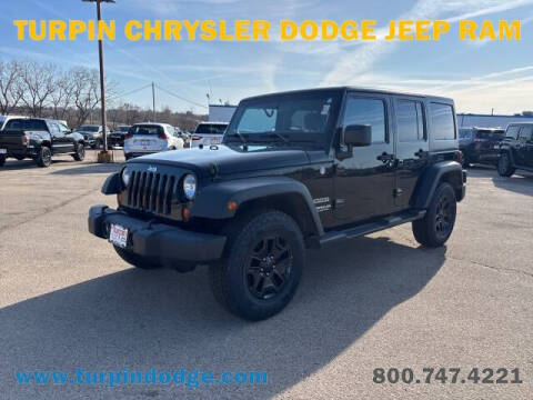 2012 Jeep Wrangler Unlimited for sale at Turpin Chrysler Dodge Jeep Ram in Dubuque IA