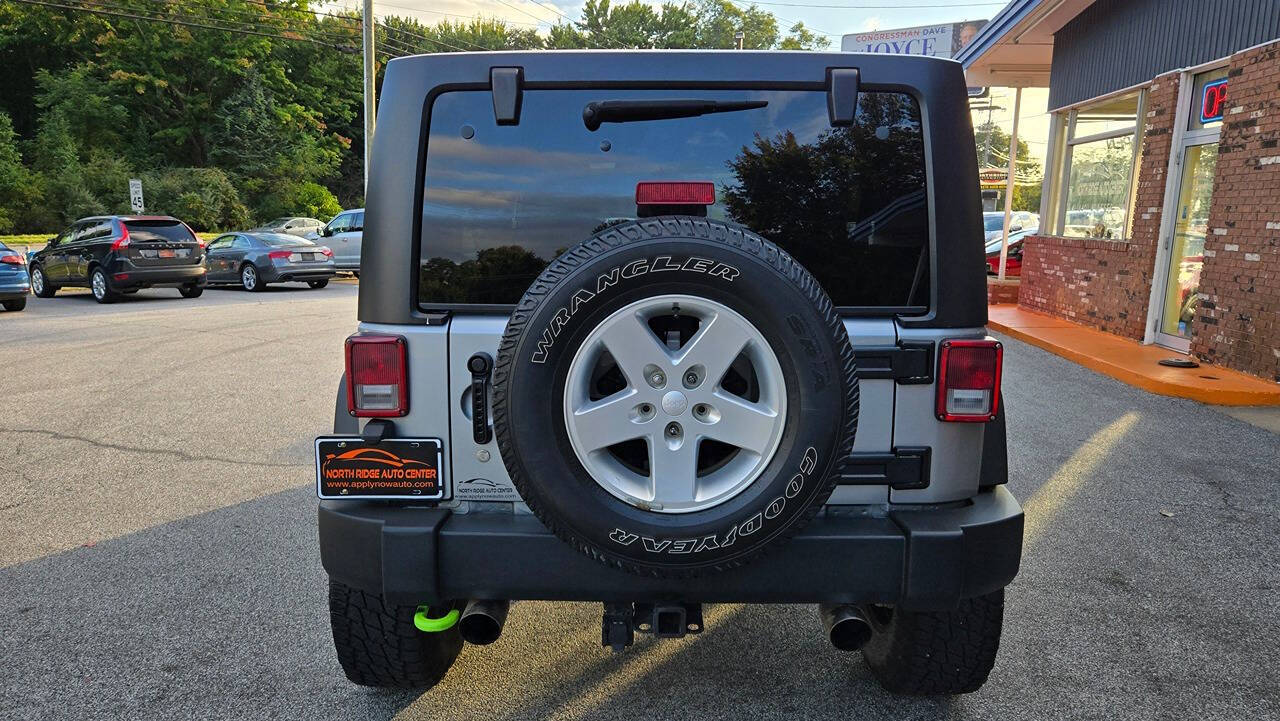 2014 Jeep Wrangler Unlimited for sale at North Ridge Auto Center LLC in Madison, OH