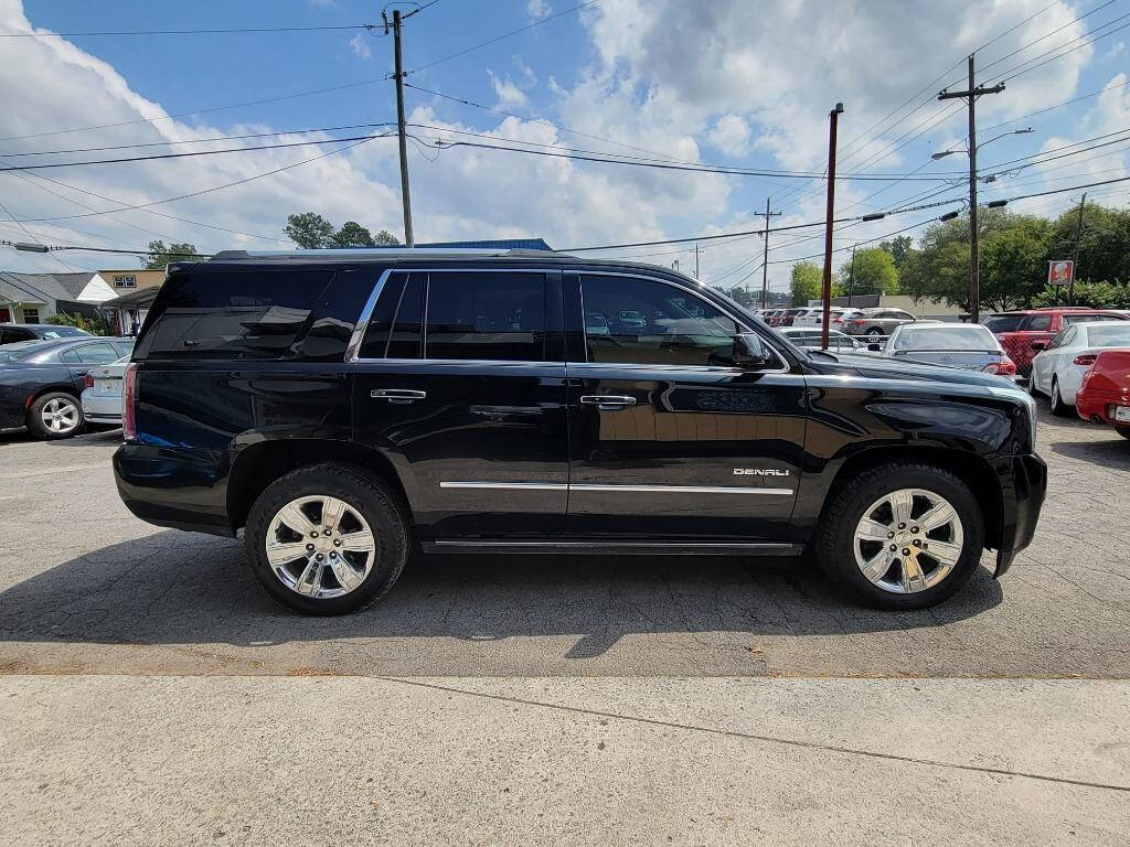 2015 GMC Yukon for sale at DAGO'S AUTO SALES LLC in Dalton, GA