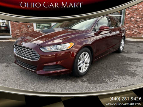 2015 Ford Fusion for sale at Ohio Car Mart in Elyria OH