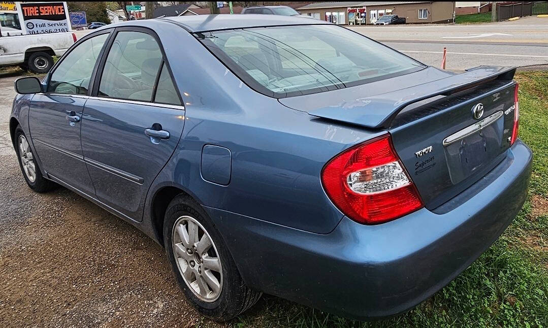 2003 Toyota Camry for sale at Art's Used Cars in Winfield, WV