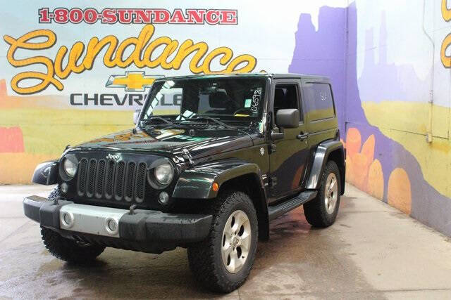 Used 2014 Jeep Wrangler Sahara with VIN 1C4AJWBG4EL106598 for sale in Grand Ledge, MI
