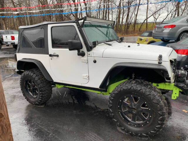 2013 Jeep Wrangler for sale at Chuckie Bizzarro's Fleetwing Auto in Erie, PA