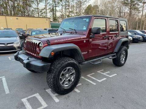 2009 Jeep Wrangler Unlimited for sale at GEORGIA AUTO DEALER LLC in Buford GA