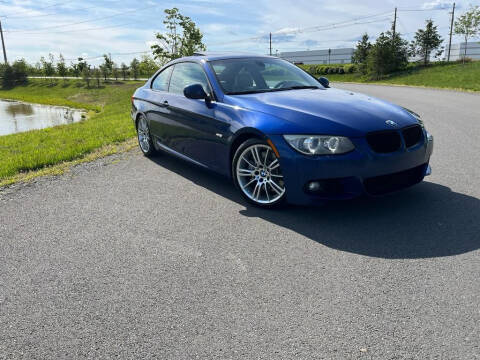 2011 BMW 3 Series for sale at BOOST MOTORS LLC in Sterling VA
