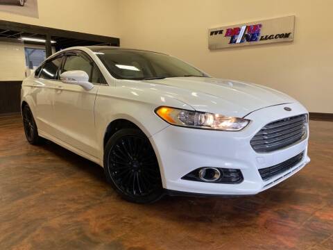 2014 Ford Fusion for sale at Driveline LLC in Jacksonville FL