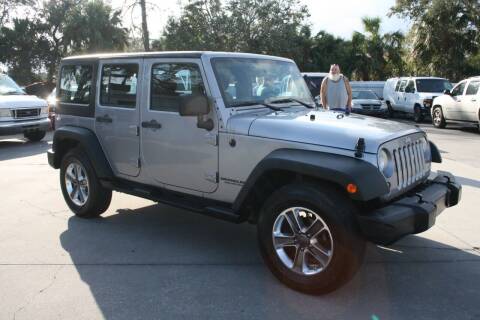2014 Jeep Wrangler Unlimited for sale at Mike's Trucks & Cars in Port Orange FL