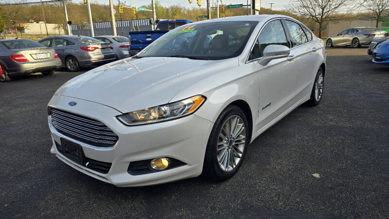 2014 Ford Fusion Hybrid for sale at Cedar Auto Group LLC in Akron OH