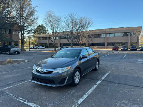 2014 Toyota Camry for sale at QUEST MOTORS in Centennial CO