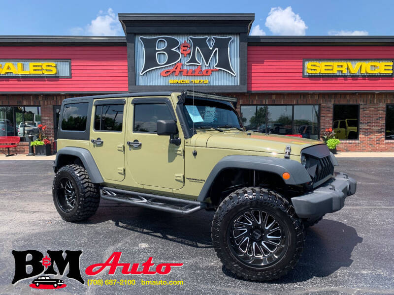 2013 Jeep Wrangler Unlimited for sale at B & M Auto Sales Inc. in Oak Forest IL