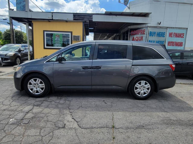 2012 Honda Odyssey for sale at DAGO'S AUTO SALES LLC in Dalton, GA