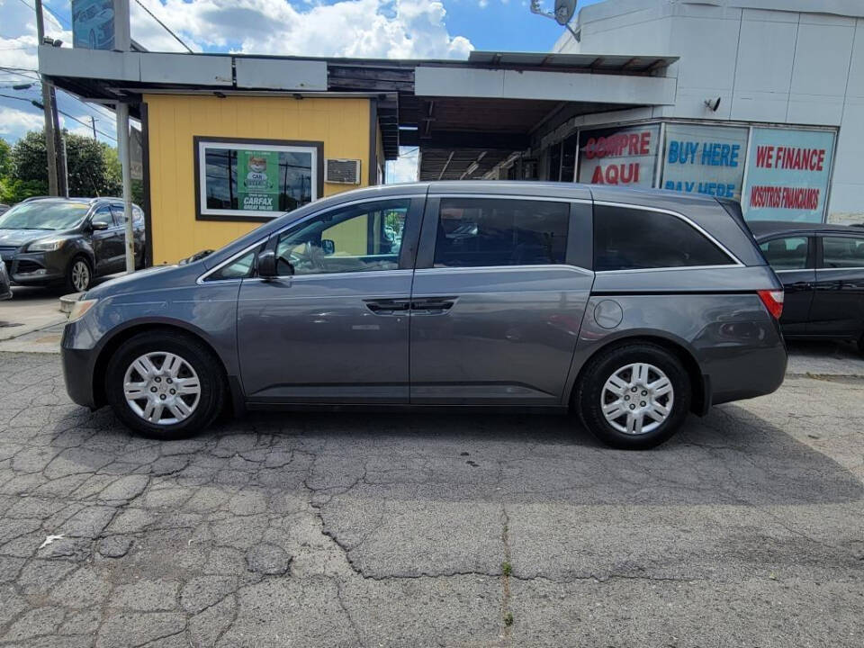 2012 Honda Odyssey for sale at DAGO'S AUTO SALES LLC in Dalton, GA