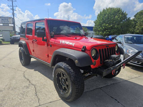 2014 Jeep Wrangler Unlimited for sale at Smithfield Auto Center LLC in Smithfield NC