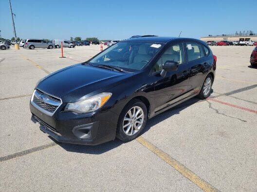 2014 Subaru Impreza for sale at NORTH CHICAGO MOTORS INC in North Chicago IL