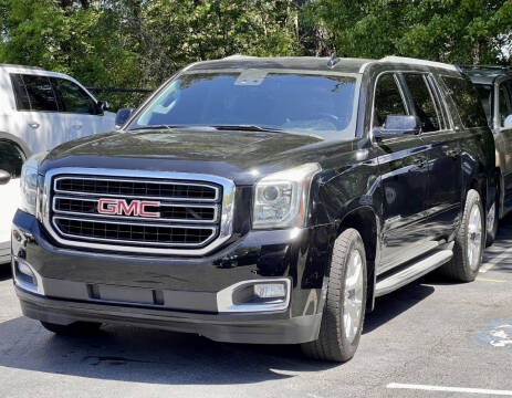 2015 GMC Yukon XL for sale at Atlanta Unique Auto Sales in Norcross GA