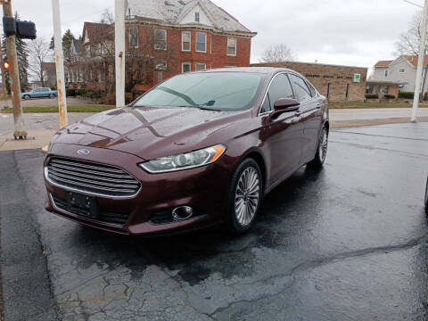 2013 Ford Fusion for sale at Sarchione INC in Alliance OH