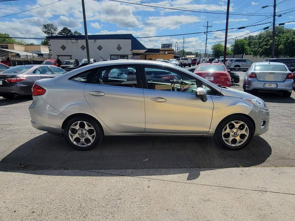 2013 Ford Fiesta for sale at DAGO'S AUTO SALES LLC in Dalton, GA