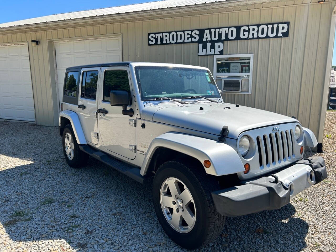 2012 Jeep Wrangler Unlimited for sale at STRODES AUTO GROUP LLP in Malta, OH