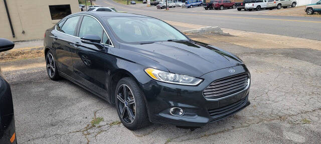 2014 Ford Fusion for sale at Cars For Less in Clarksville, TN