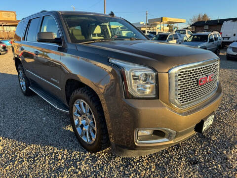 2015 GMC Yukon for sale at BERKENKOTTER MOTORS in Brighton CO