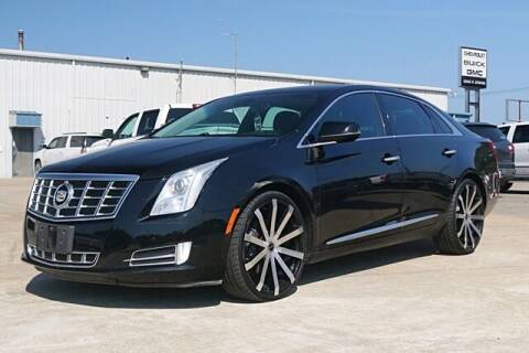 2013 Cadillac XTS for sale at STRICKLAND AUTO GROUP INC in Ahoskie NC
