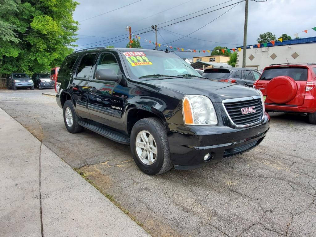 2008 GMC Yukon for sale at DAGO'S AUTO SALES LLC in Dalton, GA